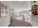 Upstairs hallway with neutral colors and ample natural light at 5830 Jasper Pointe Cir, Castle Pines, CO 80108