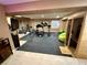 Spacious home gym featuring a full-length mirror, rubber flooring, sauna, and weight training equipment at 5830 Jasper Pointe Cir, Castle Pines, CO 80108