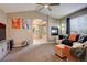 Open concept living room boasts a fireplace and leads into the bathroom at 5830 Jasper Pointe Cir, Castle Pines, CO 80108