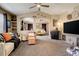 Open concept living room leads into the main bedroom with unique design and natural light at 5830 Jasper Pointe Cir, Castle Pines, CO 80108