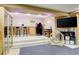 Finished basement living room includes a wet bar, TV, and cat furniture to give the animals a place to relax at 5830 Jasper Pointe Cir, Castle Pines, CO 80108