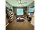 Cozy living room featuring a plush sofa, unique coffee table, and guitars adorning the walls at 5830 Jasper Pointe Cir, Castle Pines, CO 80108