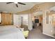 Bright and airy bedroom seamlessly transitions to a cozy sitting area and ensuite bathroom at 5830 Jasper Pointe Cir, Castle Pines, CO 80108
