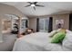 Bright main bedroom featuring a vaulted ceiling and seamless flow to a sitting area and bathroom at 5830 Jasper Pointe Cir, Castle Pines, CO 80108