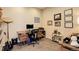 Well-lit home office featuring a wooden desk, comfortable chair, and tasteful wall decor at 5830 Jasper Pointe Cir, Castle Pines, CO 80108