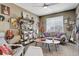Cozy sitting area with guitars and shelving, perfect for relaxing and enjoying music at 5830 Jasper Pointe Cir, Castle Pines, CO 80108