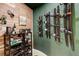 A cozy wine cellar featuring a display of wine bottles on a modern rack, perfect for tasting and storage at 5830 Jasper Pointe Cir, Castle Pines, CO 80108