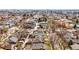Full neighborhood aerial view with city skyline featuring homes, trees, and road layout at 618 Adams St, Denver, CO 80206