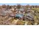 Aerial view of a classic bungalow nestled among mature trees in a vibrant neighborhood at 618 Adams St, Denver, CO 80206