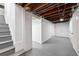 Unfinished basement with stairs and exposed ceiling beams at 618 Adams St, Denver, CO 80206