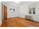 Bedroom with hardwood floors, two windows, and white walls at 618 Adams St, Denver, CO 80206
