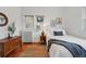 Bright bedroom with a jute rug, wood floors, and lots of natural light at 618 Adams St, Denver, CO 80206