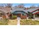 Charming brick bungalow with a covered front porch and well-maintained yard at 618 Adams St, Denver, CO 80206