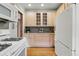 Kitchen featuring white cabinets and hardwood floors at 618 Adams St, Denver, CO 80206