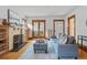 Bright living room with fireplace, hardwood floors, and french doors at 618 Adams St, Denver, CO 80206