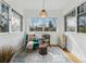 Bright sunroom with large windows, comfortable seating, and a view of the outdoors at 618 Adams St, Denver, CO 80206