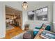 Bright sunroom with large windows, hardwood floors, and cozy seating at 618 Adams St, Denver, CO 80206