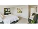 Bright bedroom with large artwork and comfortable seating at 6531 13Th St, Frederick, CO 80530