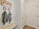 Inviting entryway with bench, coat hooks, and storage at 6531 13Th St, Frederick, CO 80530