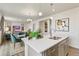 Modern kitchen with island, stainless steel appliances, and an open floor plan at 6531 13Th St, Frederick, CO 80530