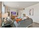 Spacious living room with gray sectional sofa and large TV at 6531 13Th St, Frederick, CO 80530