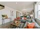 Living room features a gray sofa and a view into the kitchen at 6531 13Th St, Frederick, CO 80530