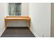 Basement with a small desk area featuring natural light and a built-in desk at 7527 E Severn Pl, Denver, CO 80230
