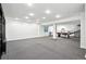 Large finished basement with plush carpeting, recessed lighting, and ample open space for recreation and entertainment at 7527 E Severn Pl, Denver, CO 80230