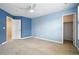 Spacious bedroom featuring neutral paint and a large walk-in closet at 7527 E Severn Pl, Denver, CO 80230