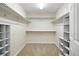 Walk-in closet with built-in shelving and ample storage space at 7527 E Severn Pl, Denver, CO 80230