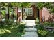 Charming brick front porch with lush landscaping and a welcoming entrance at 7527 E Severn Pl, Denver, CO 80230