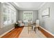 Bright home office with hardwood floors, plantation shutters, and neutral paint at 7527 E Severn Pl, Denver, CO 80230
