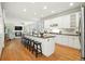 Spacious kitchen with an island, counter seating, and stainless steel appliances at 7527 E Severn Pl, Denver, CO 80230