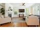 Inviting living room boasts hardwood floors, a fireplace, and ample natural light at 7527 E Severn Pl, Denver, CO 80230