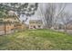 Expansive backyard showcases a well-maintained lawn, established trees, and privacy fencing at 6172 S Salida Ct, Aurora, CO 80016