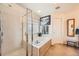 Bright bathroom with shower, tub, and decoratively framed mirror at 6172 S Salida Ct, Aurora, CO 80016