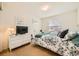 Cozy bedroom with a floral comforter, white dresser, and decorative touches at 6172 S Salida Ct, Aurora, CO 80016