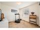 This versatile spare bedroom features neutral walls and carpet and space for exercise equipment at 6172 S Salida Ct, Aurora, CO 80016
