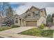 Charming home with a two car garage, a lush lawn, and mature landscaping at 6172 S Salida Ct, Aurora, CO 80016