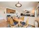 Kitchen featuring an adjacent dining area with table and chairs and view to living room at 6172 S Salida Ct, Aurora, CO 80016