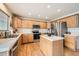 Bright kitchen featuring an island, wood cabinets and hardwood floors at 6172 S Salida Ct, Aurora, CO 80016