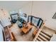 Aerial view of the open-concept living room, dining area, and entry way with beautiful natural light at 6172 S Salida Ct, Aurora, CO 80016