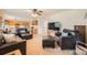 Open-concept living room flows into kitchen, creating a spacious and inviting atmosphere at 6172 S Salida Ct, Aurora, CO 80016