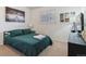 Bedroom with a bed and a nightstand and a window with white shutters at 6650 E Arizona Ave # 199, Denver, CO 80224