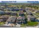 Aerial shot of a neighborhood featuring lush greenery and a residence located near Discovery Park Trail and Discovery Park at 22198 Boundstone Dr, Parker, CO 80138