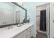 Bathroom features a dual sink vanity with a large mirror and a separate shower/tub at 22198 Boundstone Dr, Parker, CO 80138