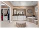 Spa-like bathroom with a soaking tub, dual vanities, and walk-in closet at 22198 Boundstone Dr, Parker, CO 80138