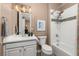 Bathroom featuring white fixtures and a shower-tub combination at 22198 Boundstone Dr, Parker, CO 80138