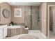 Another angle of the bathroom shows the tile shower, soaking tub, and vanity at 22198 Boundstone Dr, Parker, CO 80138