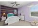 Stylish bedroom with colorful accents, a comfortable bed, and natural light at 22198 Boundstone Dr, Parker, CO 80138